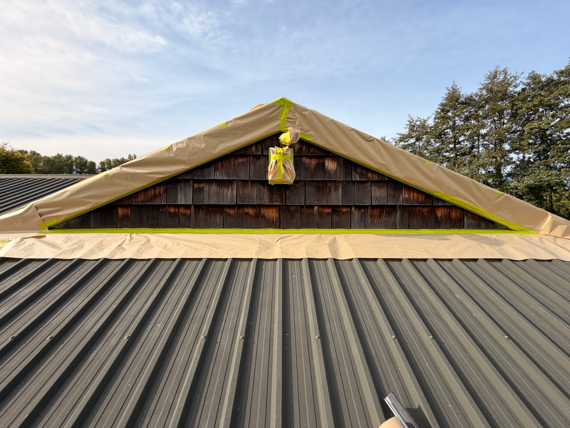 Gable end masked and prepped for a fresh cedar shingle finish